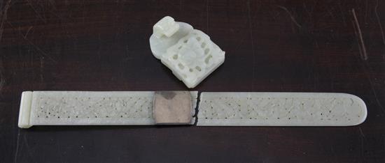 A Chinese pale celadon jade belt buckle section and a similar page turner, late 19th century, 28.5cm, broken with an old silver repair